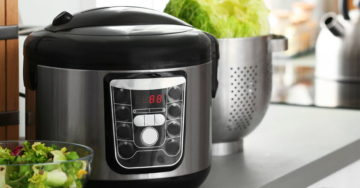 A slow cooker sitting on a counter in an RV kitchen