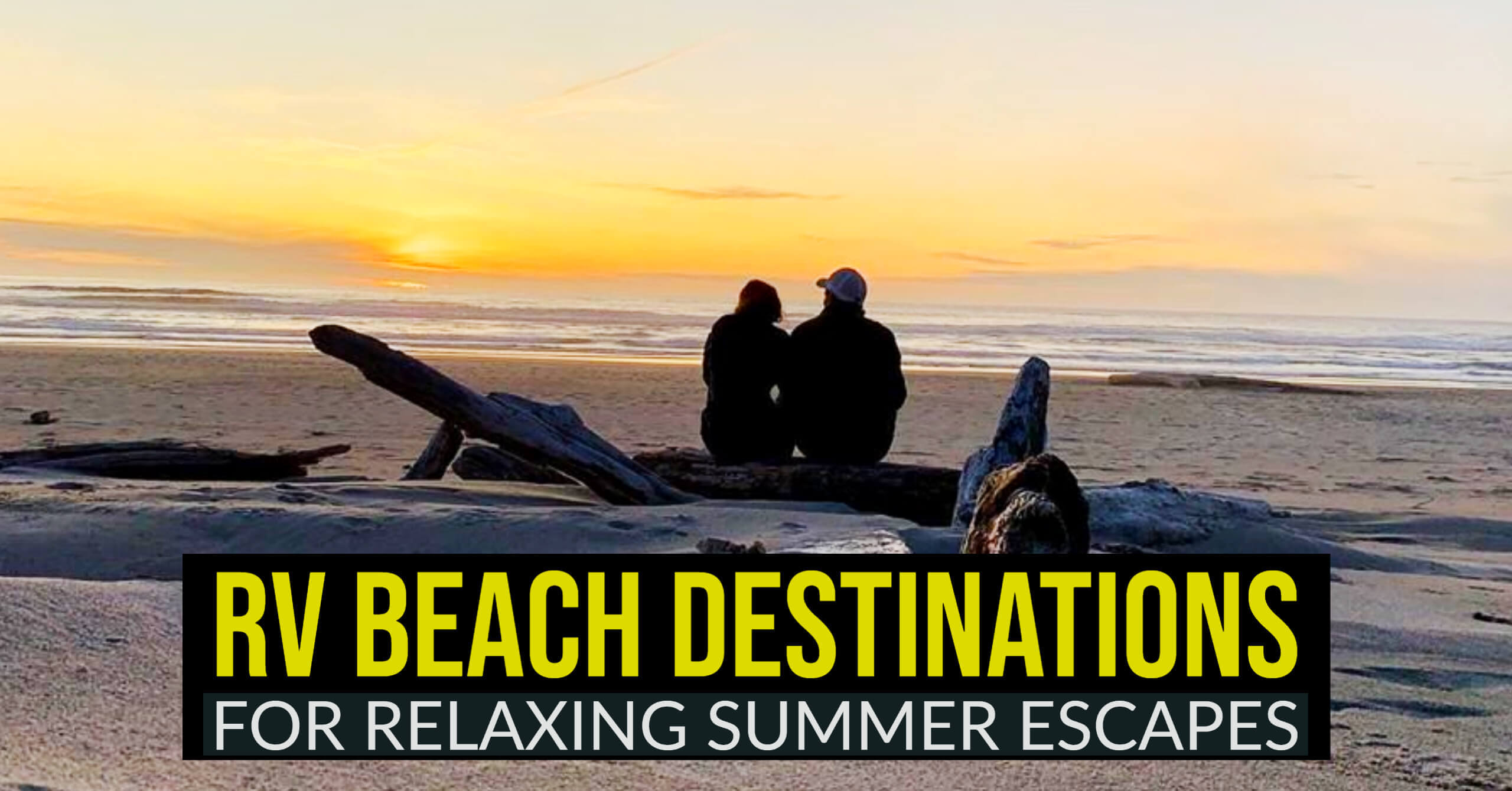 Couple Sitting on a log enjoying a beach sunset