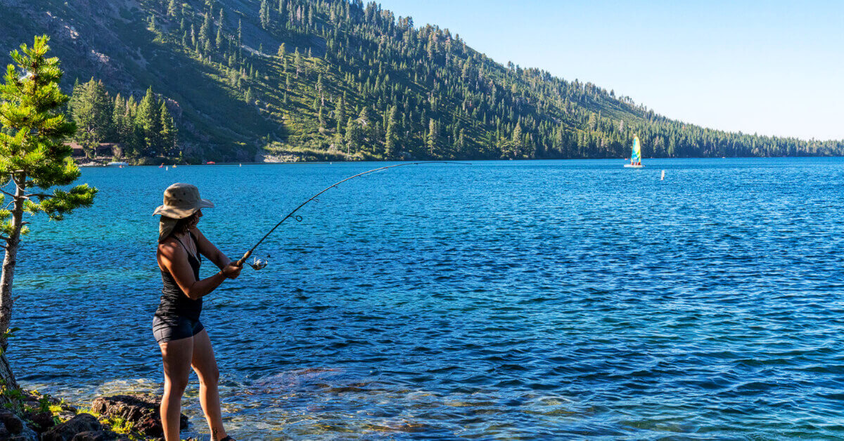 A woman fishing at beautiful Lake Tahoe
