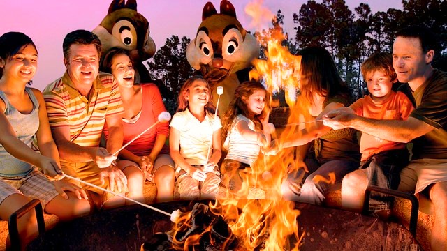 Families enjoying a campfire at Disney World's Fort Wilderness Resort and Campground