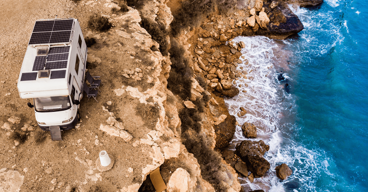 RVers boondocking on a cliff overlooking the ocean