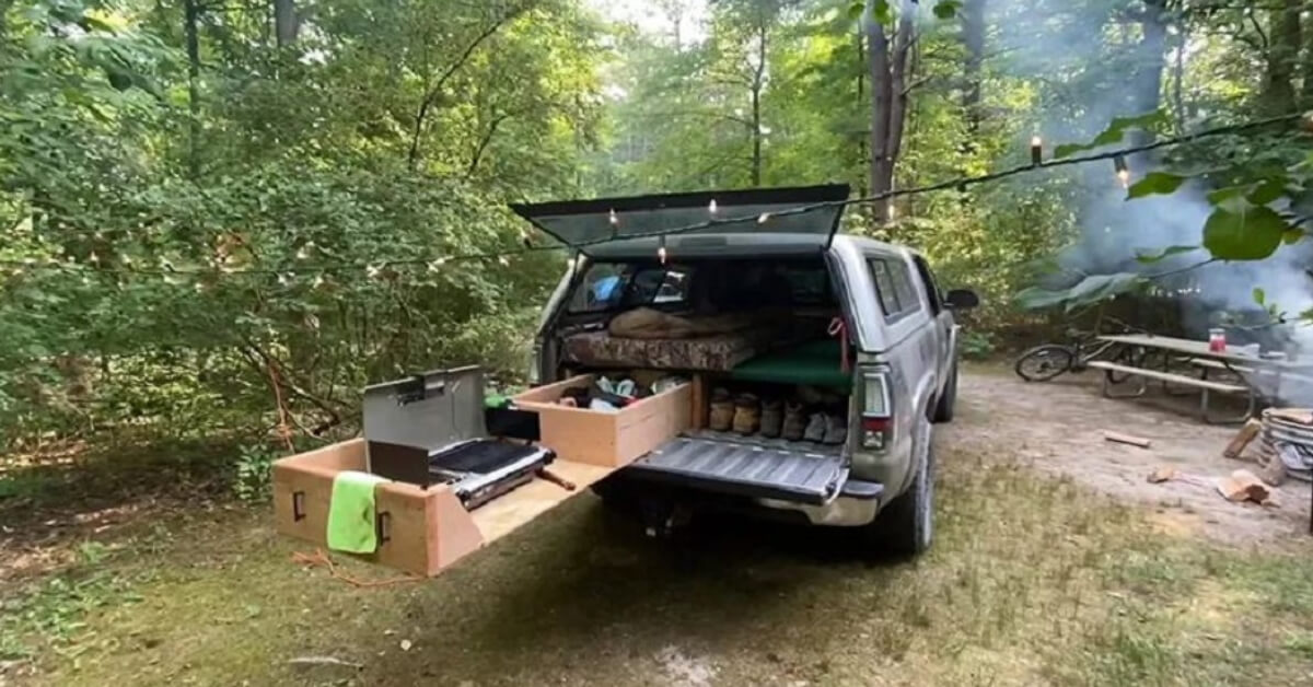 Pickup truck with a slide out kitchen at a campground