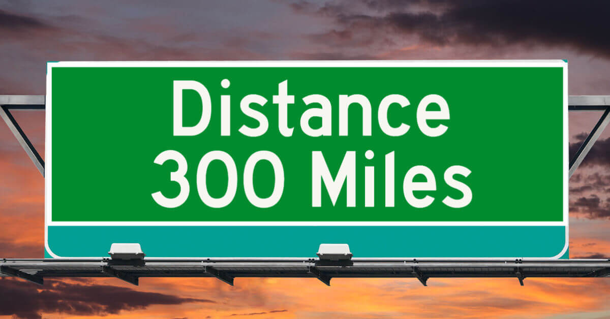 Freeway sign showing distance of 300 miles
