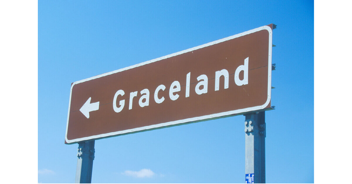 A road sign pointing to Graceland
