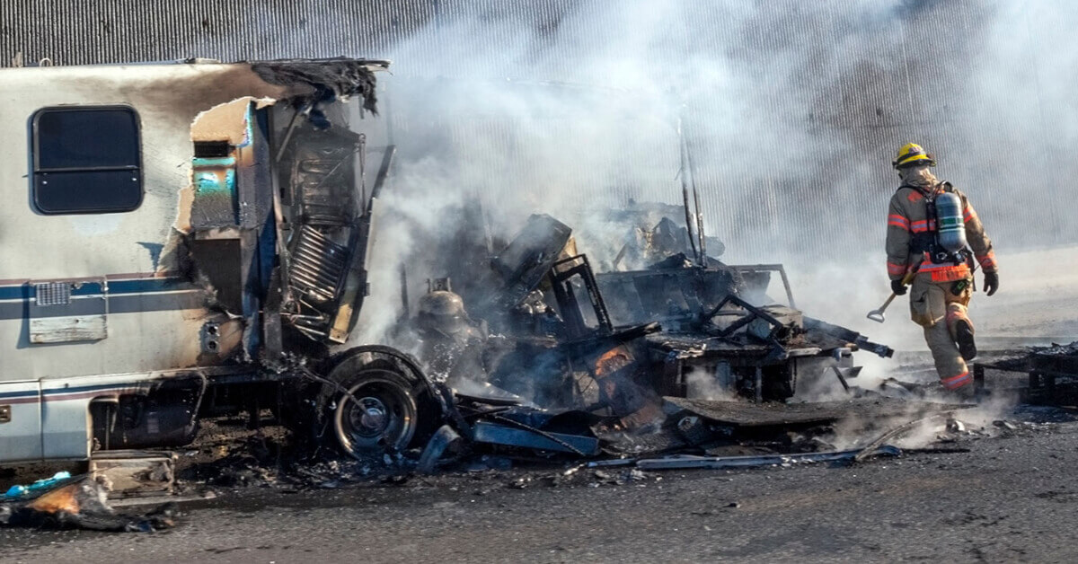 Fire Department mopping up an RV fire scene