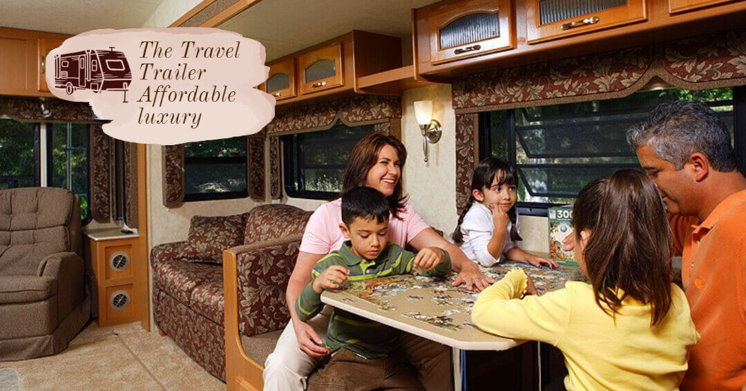 Family in their travel trailer working on putting together a puzzle