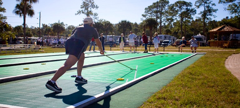 RVers playing shuffleboard at the Shady Acres Travel Park in Fort Myers Florida
